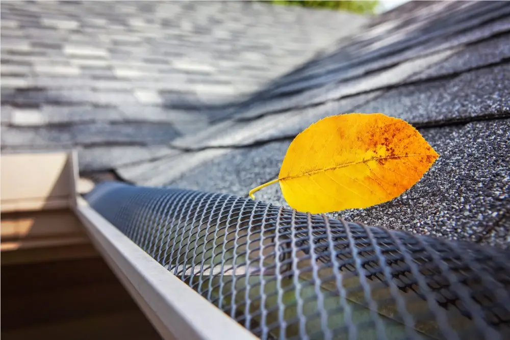 Micro-mesh gutter guard installed along a residential gutter