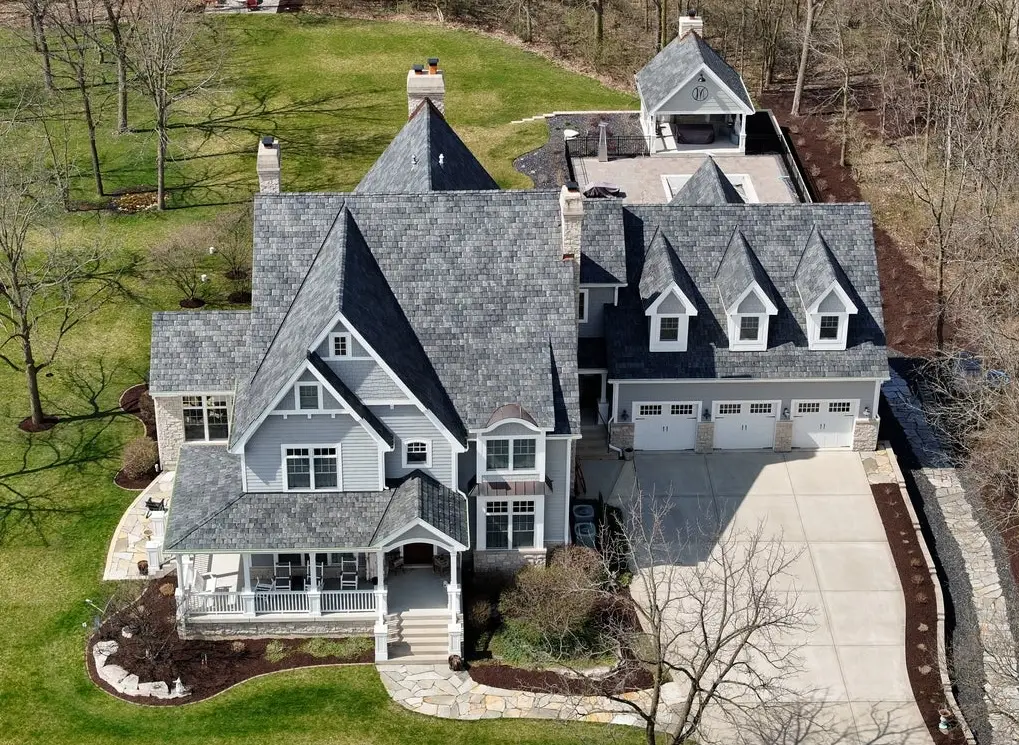 Aerial view of a large Minooka home with a gray Brava synthetic slate roof